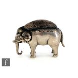 A hallmarked silver pin cushion modelled as a standing elephant, height 3cm, length 4cm,