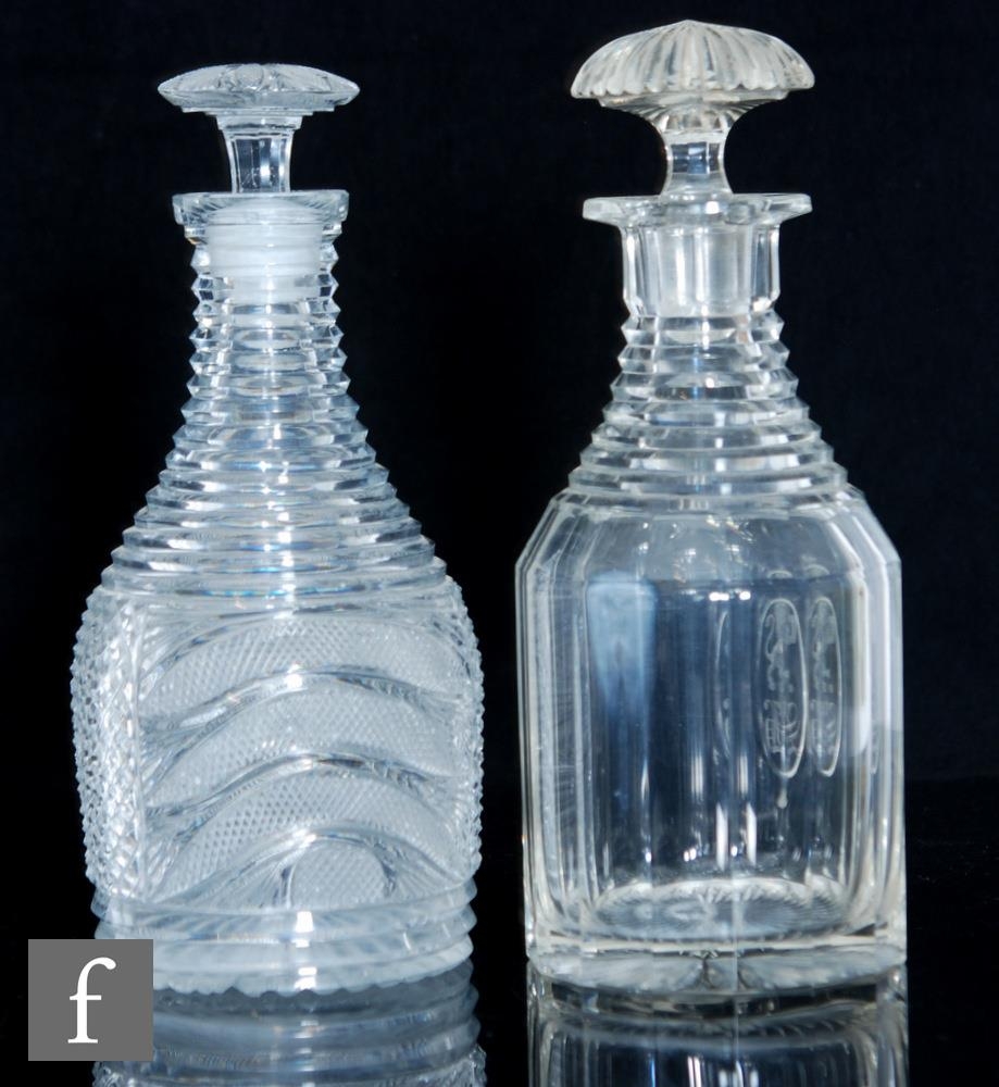 A late Georgian Regency cylinder decanter with a slice cut body detailed with a central oval