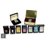 A collection of seven Zippo lighters, each in their original plastic cases to include Jack