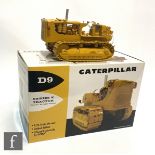 A Caterpillar 1:25 scale diecast model D9 Series E Tractor, 49-3172, complete with umbrella,