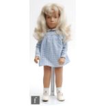 A Trendon Sasha 107 Blonde Gingham doll, blonde hair, dressed in original blue gingham dress and