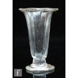 An 18th Century jelly glass circa 1750, the fluted trumpet form bowl with folded rim, flattened knop