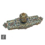 A 19th Century French Napoleon III cloisonne inkwell of fluted rectangular form with a central well,