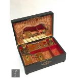 A 19th Century inlaid ebonised musical dressing table and sewing box, playing two airs,