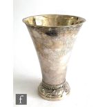 An early 20th Century Swedish silver vase with circular base below beaded border and flared body