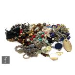 A large parcel lot of assorted modern costume jewellery items to include beads, brooches,