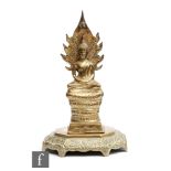 An 19th or 20th Century Sino-Tibetan polished cast metal figure of Shakayumi Buddha, raised on a