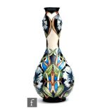 A Moorcroft Pottery Collectors Club gourd vase decorated in the Centaurea pattern designed by Rachel