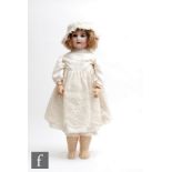 An Armand Marseille bisque socket head doll, sleeping blue eyes, open mouth with teeth, painted