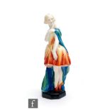 A Royal Worcester figurine titled Columbine modelled, by Doris Lindner, as a ballerina dressed in an