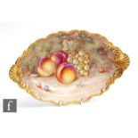 A Royal Worcester Fallen Fruits shaped oval dish decorated by Ayrton with hand painted peaches and