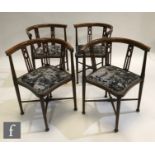 A set of four Edwardian stained beech line inlaid tub shaped corner chairs, with pierced back splats