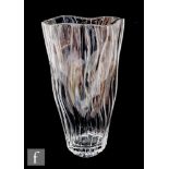 A 20th Century clear glass vase, of slender triangular section with waved ribbed decoration,