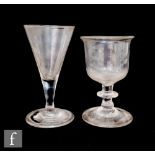 An 18th Century drinking glass with conical bowl, slender plain stem and a shallow folded foot,