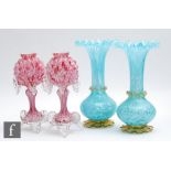 A pair of late 19th Century continental glass vases of footed globe and shaft form with a wide