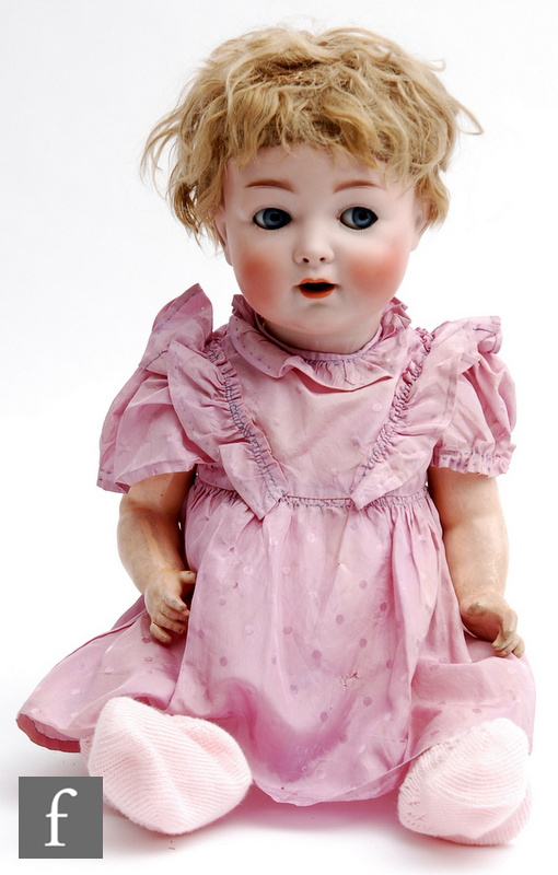 An early 20th Century German Hertel Schwab bisque socket head doll, with naughty blue eyes, open
