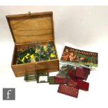 A collection of assorted Meccano pieces in red and green, with a collection of original and