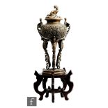 A Chinese late Qing Dynasty (1644-1912) bronze censer, the plinth support with open burner