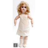 A late 19th Century Tete Jumeau bisque socket head doll, size 7, with fixed blue paperweight eyes,