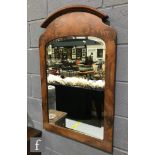 A contemporary bevel-cut pier mirror of arched form in the Victorian style, with acanthus leaf and