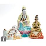 A collection of 20th Century Chinese and Indian figures, to include a porcelain figure of Guanyin