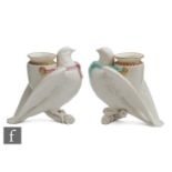 Two 19th Century Royal Worcester spill vases modelled as doves perched on a branch with an urn to