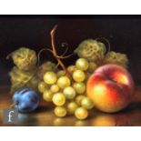 ZIEGLER (CONTEMPORARY) - A still life with grapes and a peach on a table top, oil on panel,