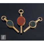 A modern 9ct hallmarked bloodstone and carnelian set watch key with two further similar stone set
