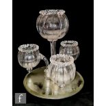 A late 19th Century table centre epergne, the central posy vase of fluted spherical form raised to a