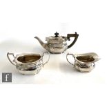 A hallmarked silver three piece boat shaped bachelor's tea set with part reeded decoration, total