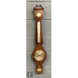 A 19th Century rosewood wheel barometer, with hygrometer, level, silvered thermometer and