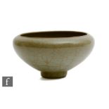 A Chinese Guan type celadon glazed bowl, possibly Southern Song Dynasty (1127-1279), the tapered