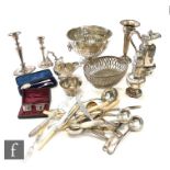 A parcel lot of assorted silver and hallmarked silver items to include a silver castor, a