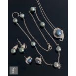 Two modern silver chains each set with Tahitian style grey pearls, each with a matching pair of