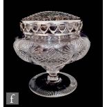 A large late Victorian clear cut glass footed bowl, of ogee form with fan and diamond cut repeated