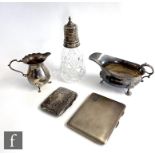 Five items of hallmarked silver, two cigarette cases, a cream jug, a sauce boat and a silver and cut