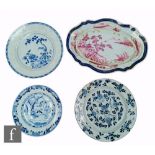 A collection of 18th Century Chinese export porcelain plates, to include three blue and one white