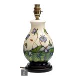 A Moorcroft Pottery lamp base decorated in the Hepatica pattern designed by Emma Bossons, with