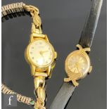 A lady's 9ct Rotary wrist watch, batons to a circular dial and leather strap, total weight 8g,