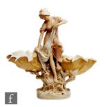 An early 20th Century Royal Dux Art Nouveau table centre modelled as a maiden perched on a