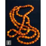 A single row of butterscotch amber beads, weight 33g, approximately ninety beads in total, length