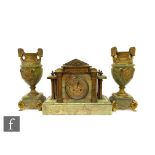 A 20th Century gilt metal mounted green onyx clock garniture set, of classical form, with two urn