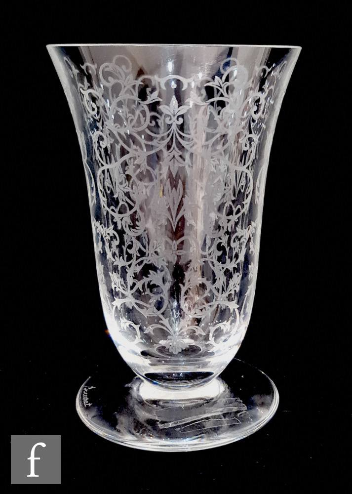 A 20th Century Baccarat clear crystal vase of footed bell form, acid cut with a repeat foliate