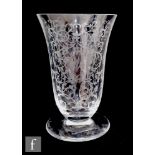 A 20th Century Baccarat clear crystal vase of footed bell form, acid cut with a repeat foliate