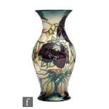 A Moorcroft Pottery vase decorated in the Hellebore pattern designed by Nicola Slaney, impressed