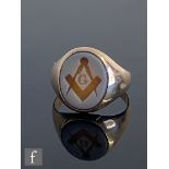 An early 20th Century 14ct Masonic signet ring, with compass and set square engraved to an oval