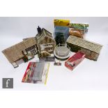 A collection of model railway scenic accessories, to include buildings by JG Miniatures and similar,
