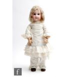 A Tete Jumeau bisque socket head doll, with paperweight blue eyes, painted closed mouth, painted