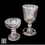 An early 19th Century trick soda glass with a double walled bowl and knopped stem raised to a folded