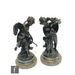 A late 19th or early 20th Century French bronze figure of a winged cupid with bow and quiver and a